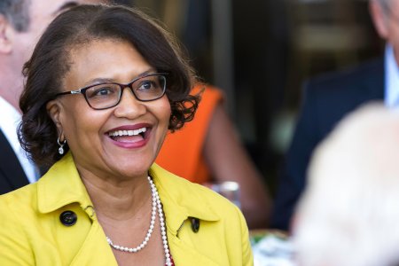 Close up of Dr. Elaine Batchlor, a middle-aged Black woman, smiling at an event
