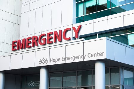 Close up of red emergency sign on emergency room exterior